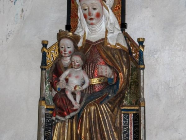 Träskulptur föreställande motivet Anna själv tredje.