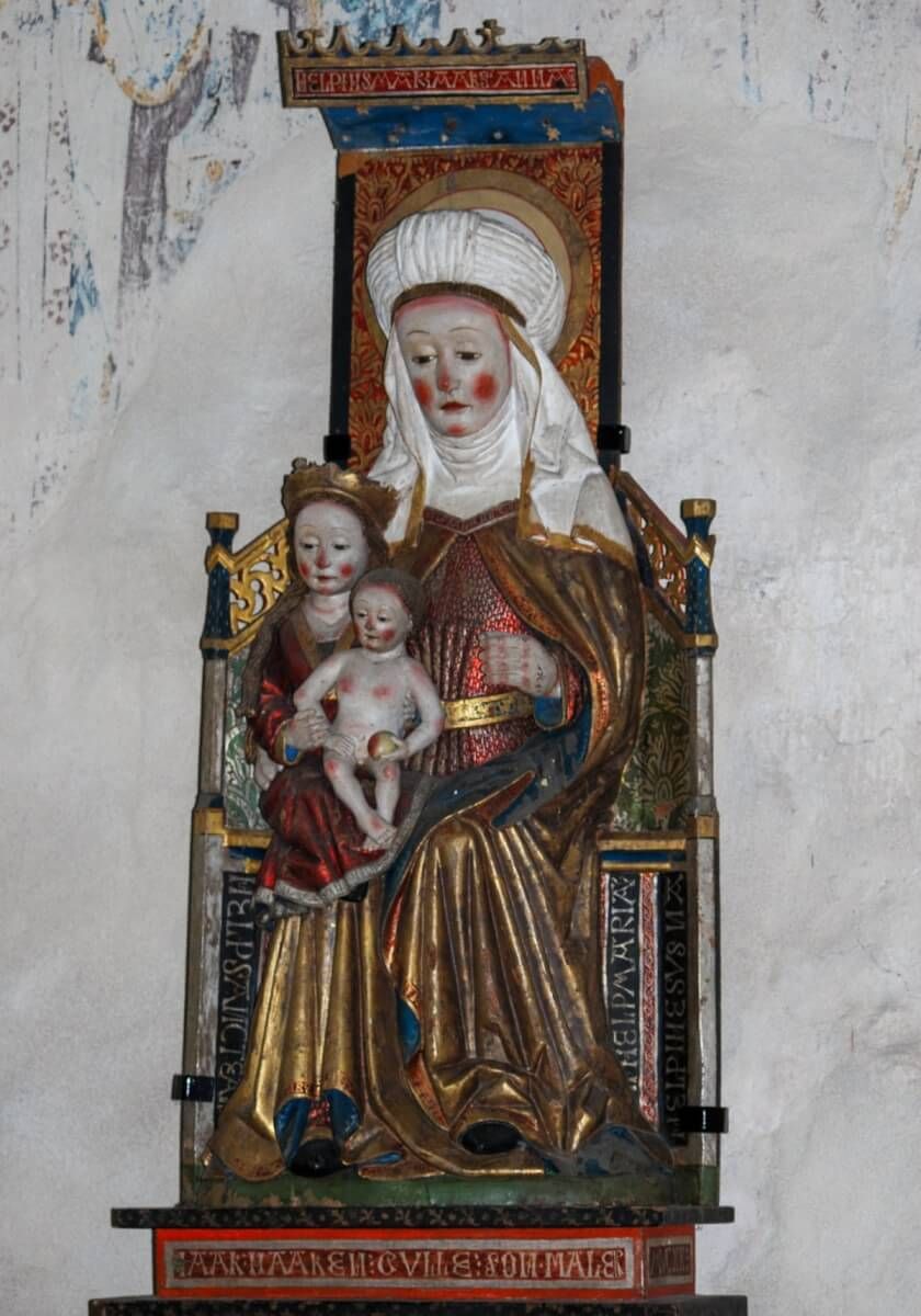 Träskulptur föreställande motivet Anna själv tredje.